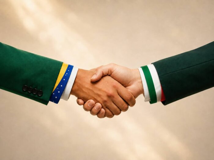 Exportações da Itália para Brasil e Argentina crescem 21% com o acordo UE-Mercosul; Confindustria prepara missão empresarial em setembro 1 Aperto de mãos com mangas nas cores das bandeiras do Brasil e da Itália, simbolizando a parceria comercial entre os dois países