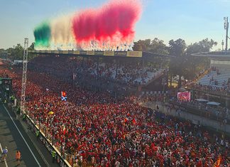 GP de Monza 2026: como 403 mil presenças movimentam o turismo na Lombardia Multidão de torcedores na pista e nas arquibancadas do Autódromo de Monza sob fumaça verde, branca e vermelha